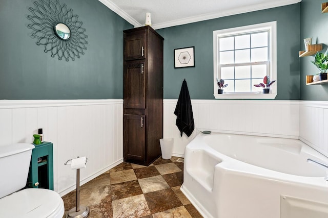 8072 Bing Hill Rd, Adams Run, SC 29426 - bathroom with a bath, ornamental molding, toilet, and wainscoting