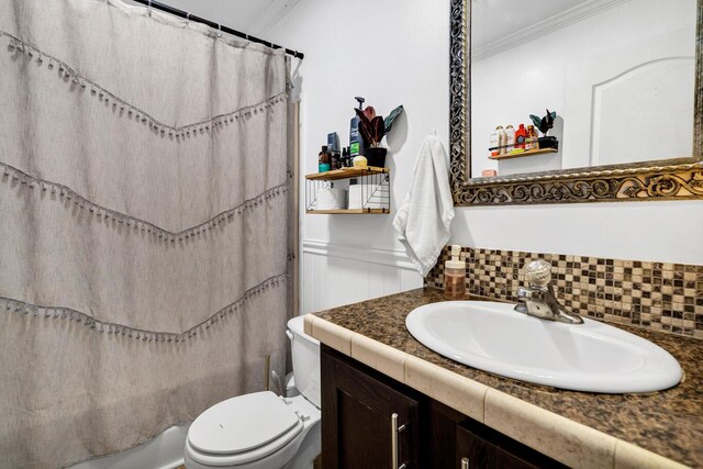 8072 Bing Hill Rd, Adams Run, SC 29426 - full bath featuring a wainscoted wall, crown molding, toilet, shower / tub combo with curtain, and vanity