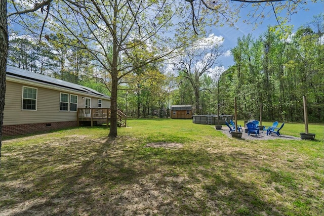 8072 Bing Hill Rd, Adams Run, SC 29426 - view of yard with a fire pit, an outbuilding, a deck, and a storage shed