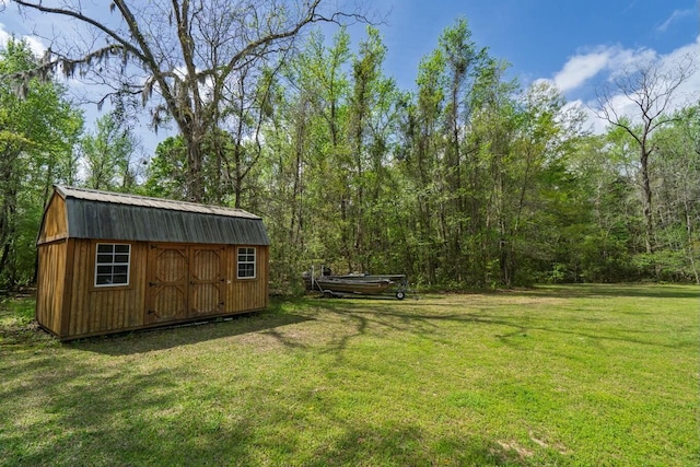 8072 Bing Hill Rd, Adams Run, SC 29426 - view of yard featuring an outbuilding, a forest view, and a storage shed