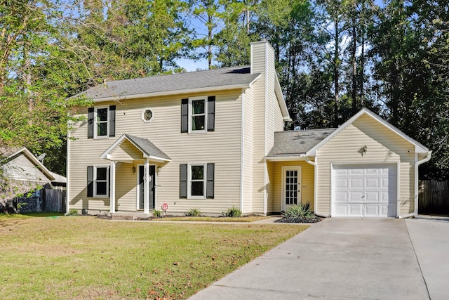 colonial home with a front yard and a garage