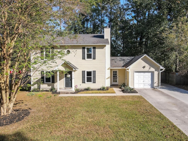 colonial-style house with a front yard and a garage