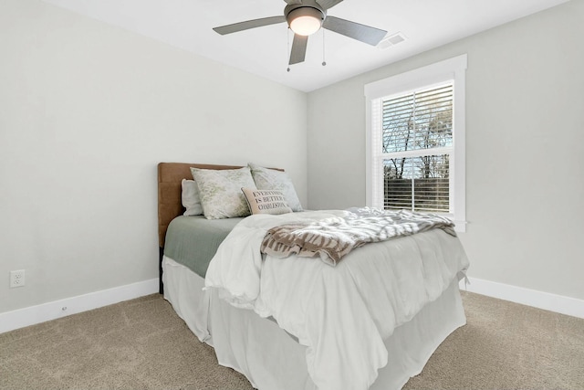 bedroom with light carpet and ceiling fan