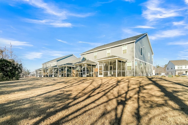 back of house with a sunroom