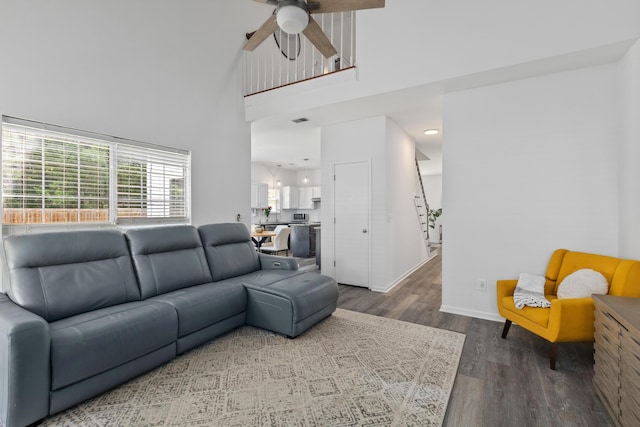 3202 Middleburry Ln, Charleston, SC 29414 - living room with wood finished floors, ceiling fan, stairway, a towering ceiling, and baseboards