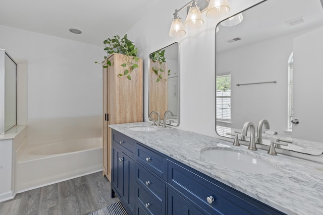 3202 Middleburry Ln, Charleston, SC 29414 - bathroom with wood finished floors, a bath, and double vanity