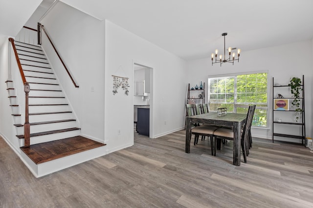 3202 Middleburry Ln, Charleston, SC 29414 - dining area featuring a chandelier, wood finished floors, stairs, and baseboards