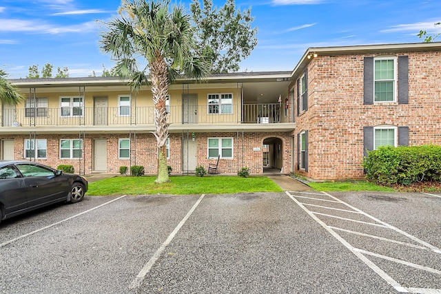 view of property with uncovered parking