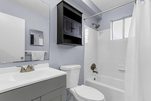 full bathroom featuring vanity, shower / bath combo with shower curtain, and toilet