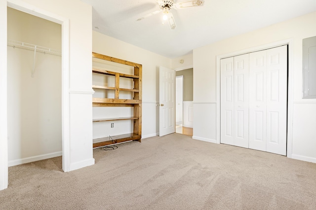 unfurnished bedroom with ceiling fan and carpet floors