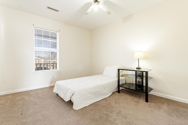 carpeted bedroom with ceiling fan