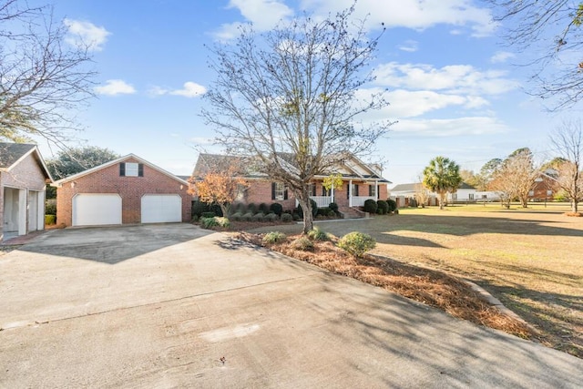 view of front of home with a front yard and a garage