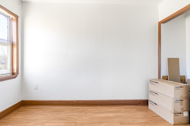 unfurnished room with plenty of natural light and light wood-type flooring