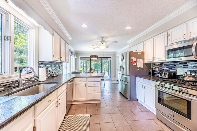 409 Santee Dr, Santee, SC 29142 - kitchen featuring stainless steel appliances, a sink, a textured ceiling, recessed lighting, and a ceiling fan