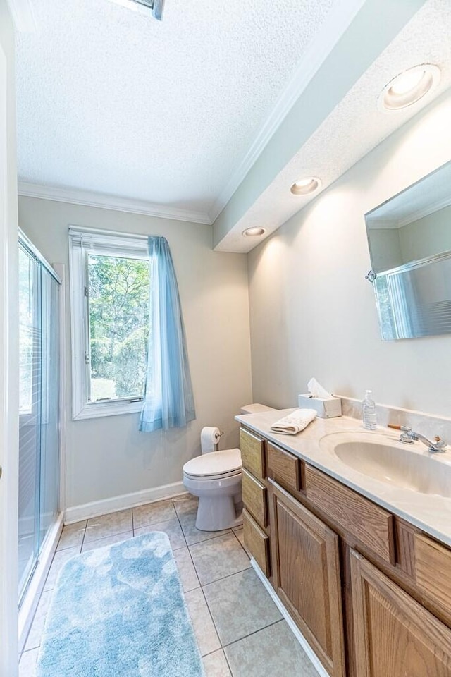 409 Santee Dr, Santee, SC 29142 - bathroom featuring ornamental molding, vanity, toilet, a shower stall, and a textured ceiling