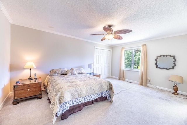 409 Santee Dr, Santee, SC 29142 - bedroom with carpet, crown molding, a closet, a textured ceiling, and baseboards