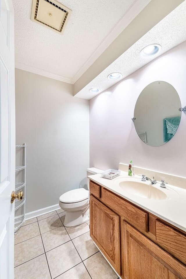409 Santee Dr, Santee, SC 29142 - half bathroom with ornamental molding, vanity, toilet, a textured ceiling, and tile patterned floors