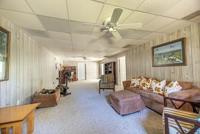 409 Santee Dr, Santee, SC 29142 - living room with ceiling fan, a drop ceiling, carpet floors, and wooden walls