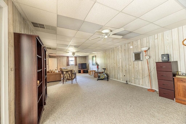 409 Santee Dr, Santee, SC 29142 - sitting room with a ceiling fan, carpet floors, a paneled ceiling, and wood walls