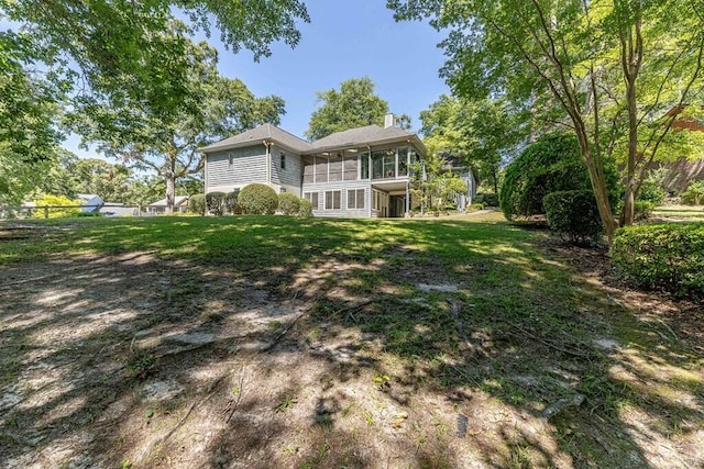 409 Santee Dr, Santee, SC 29142 - back of property featuring a sunroom and a chimney
