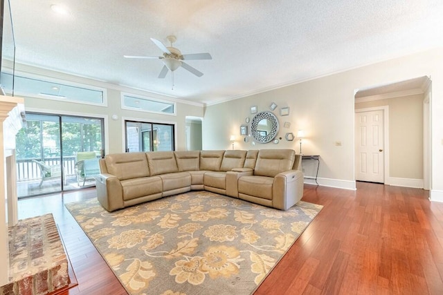 409 Santee Dr, Santee, SC 29142 - living area with a ceiling fan, crown molding, baseboards, wood finished floors, and a textured ceiling