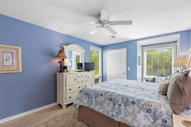 1376 Pelican Watch Villas, Seabrook Island, SC 29455 - bedroom featuring baseboards, light wood finished floors, multiple windows, and a ceiling fan