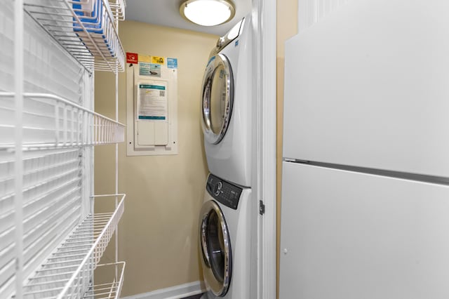 1376 Pelican Watch Villas, Seabrook Island, SC 29455 - laundry room with stacked washer and clothes dryer and baseboards