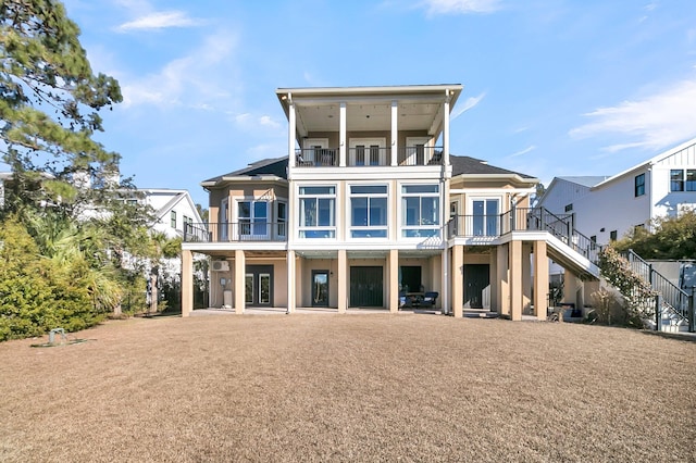 back of house featuring a balcony