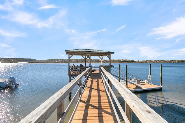 dock area featuring a gazebo and a water view