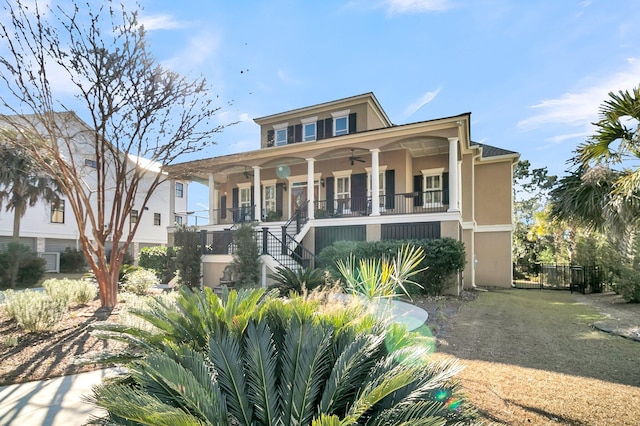 view of front of home featuring ceiling fan and covered porch