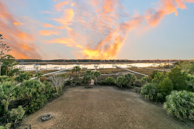 yard at dusk with a water view