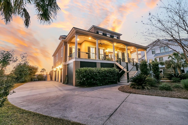 view of front of house with ceiling fan and covered porch