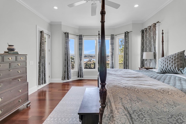 bedroom with ceiling fan, crown molding, and dark wood-type flooring