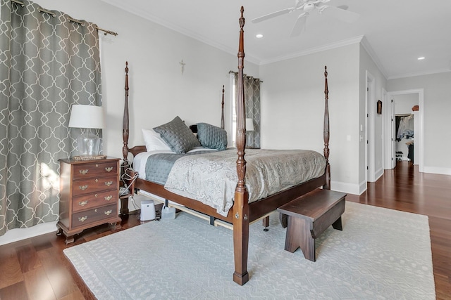 bedroom featuring ceiling fan, dark hardwood / wood-style flooring, and ornamental molding