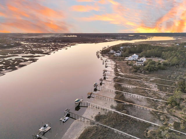 aerial view at dusk with a water view