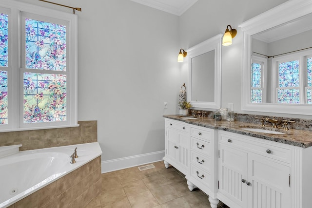 bathroom with tiled bath, crown molding, tile patterned flooring, and vanity