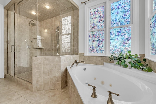 bathroom with shower with separate bathtub and tile patterned floors