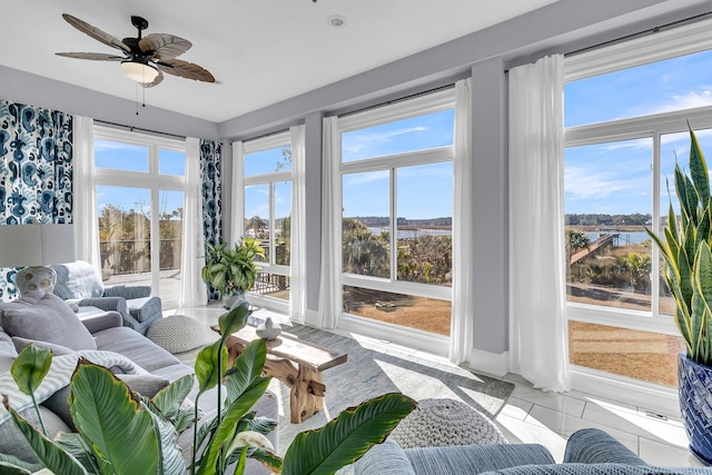 sunroom featuring ceiling fan