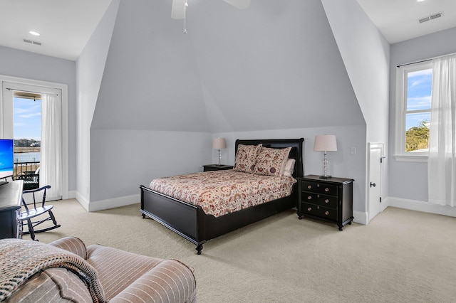 bedroom featuring access to outside, vaulted ceiling, ceiling fan, and light colored carpet