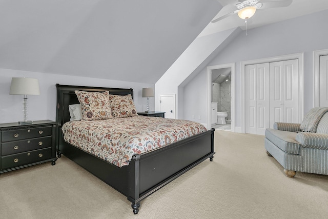 carpeted bedroom with ceiling fan, ensuite bathroom, and lofted ceiling