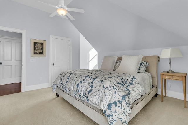 carpeted bedroom featuring ceiling fan and lofted ceiling