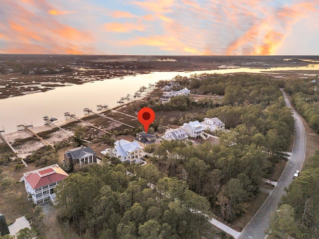 aerial view at dusk with a water view