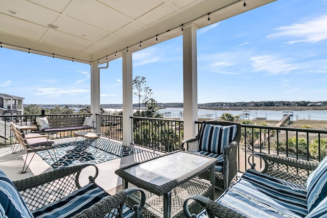 exterior space with a balcony and a water view