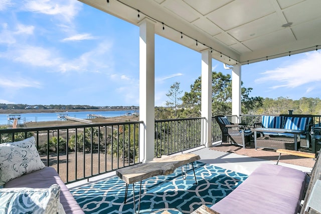 balcony featuring a water view