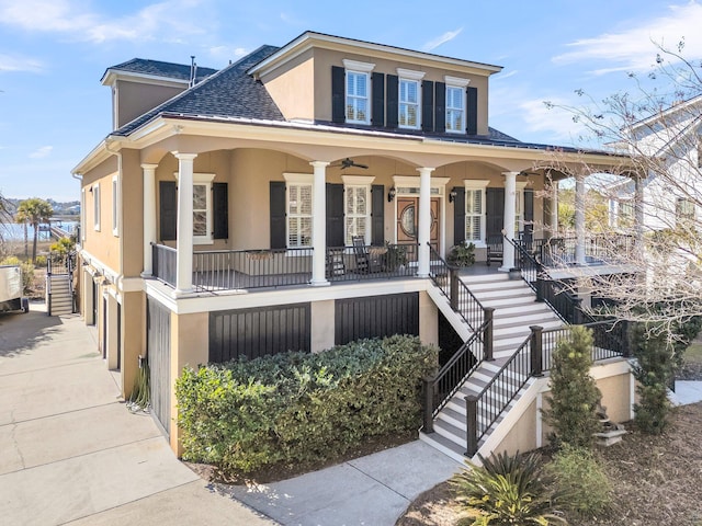 view of front facade featuring a porch and a garage