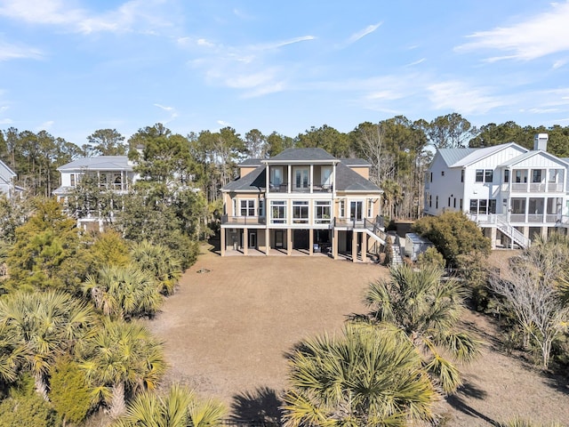 back of house featuring a balcony