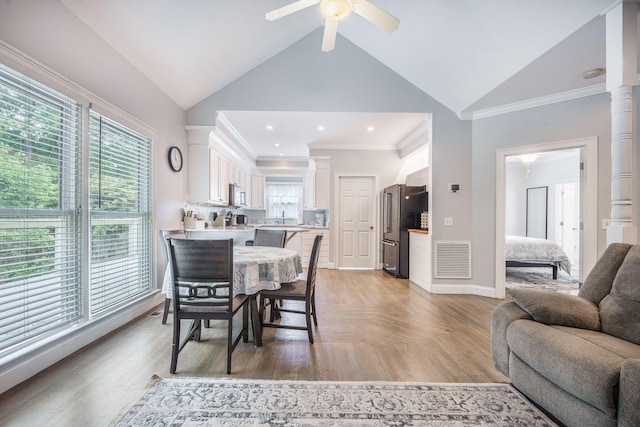 2177 Gulf Dr, Mount Pleasant, SC 29464 - dining area with crown molding, a ceiling fan, baseboards, and high vaulted ceiling