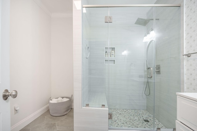 2177 Gulf Dr, Mount Pleasant, SC 29464 - bathroom with ornamental molding, vanity, a shower stall, tile patterned flooring, and baseboards