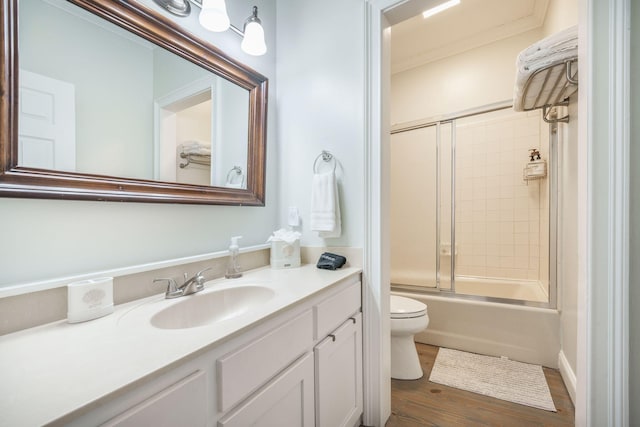 2177 Gulf Dr, Mount Pleasant, SC 29464 - bathroom featuring wood finished floors, toilet, vanity, and combined bath / shower with glass door