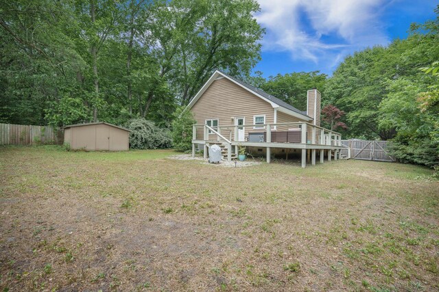 2177 Gulf Dr, Mount Pleasant, SC 29464 - back of property with a wooden deck, a storage shed, an outdoor structure, a chimney, and stairway